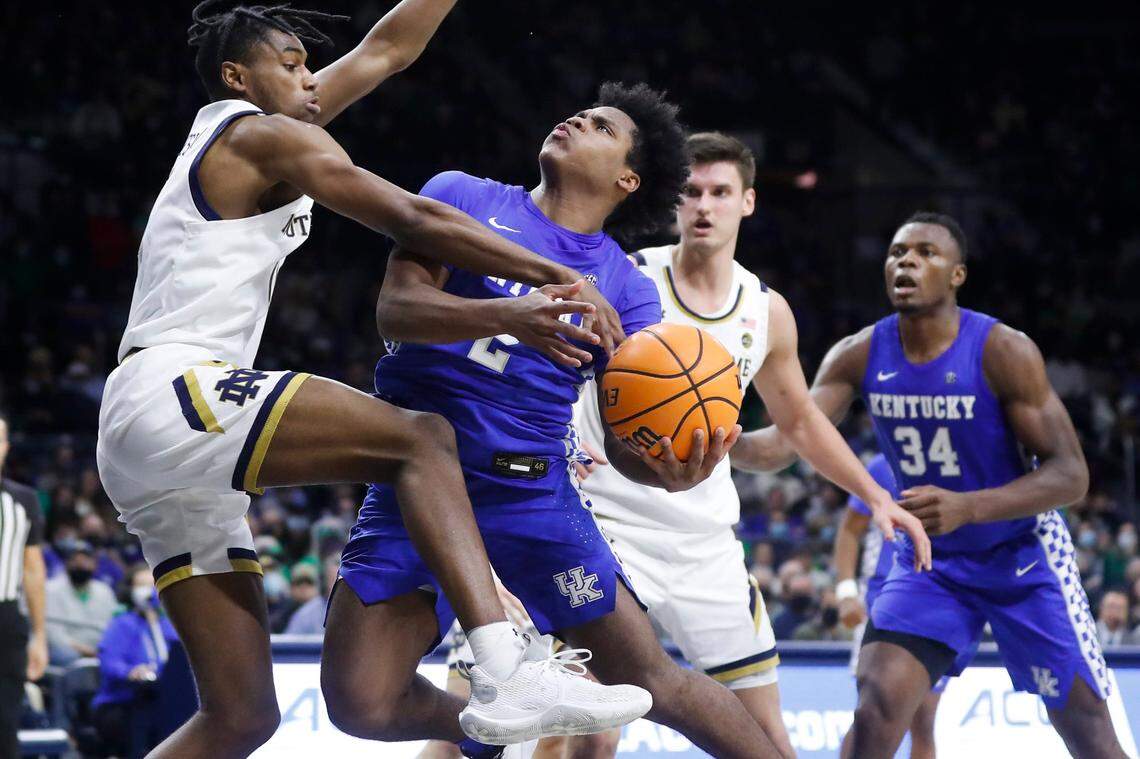Notre Dame’s Blake Wesley, left, met Kentucky’s Sahvir Wheeler (2) near the basket. Wheeler was limited to three points and two assists with two turnovers Saturday night.
