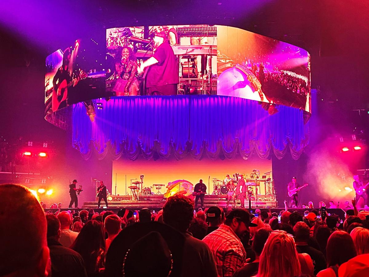 Fans of singer, rapper, and songwriter Jelly Roll applaud for his band members on stage during their performance at Rupp Arena on November 8, 2024, in Lexington, Ky.