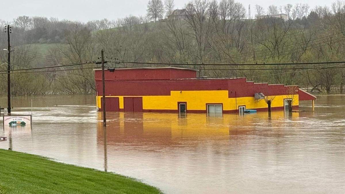 Floodwaters continued to rise Sunday, April 6, 2025 in Falmouth. Pendleton County officials issued emergency evacuation orders for Falmouth and Butler on Saturday, and access to much of Falmouth and all of Butler was cut off Sunday.