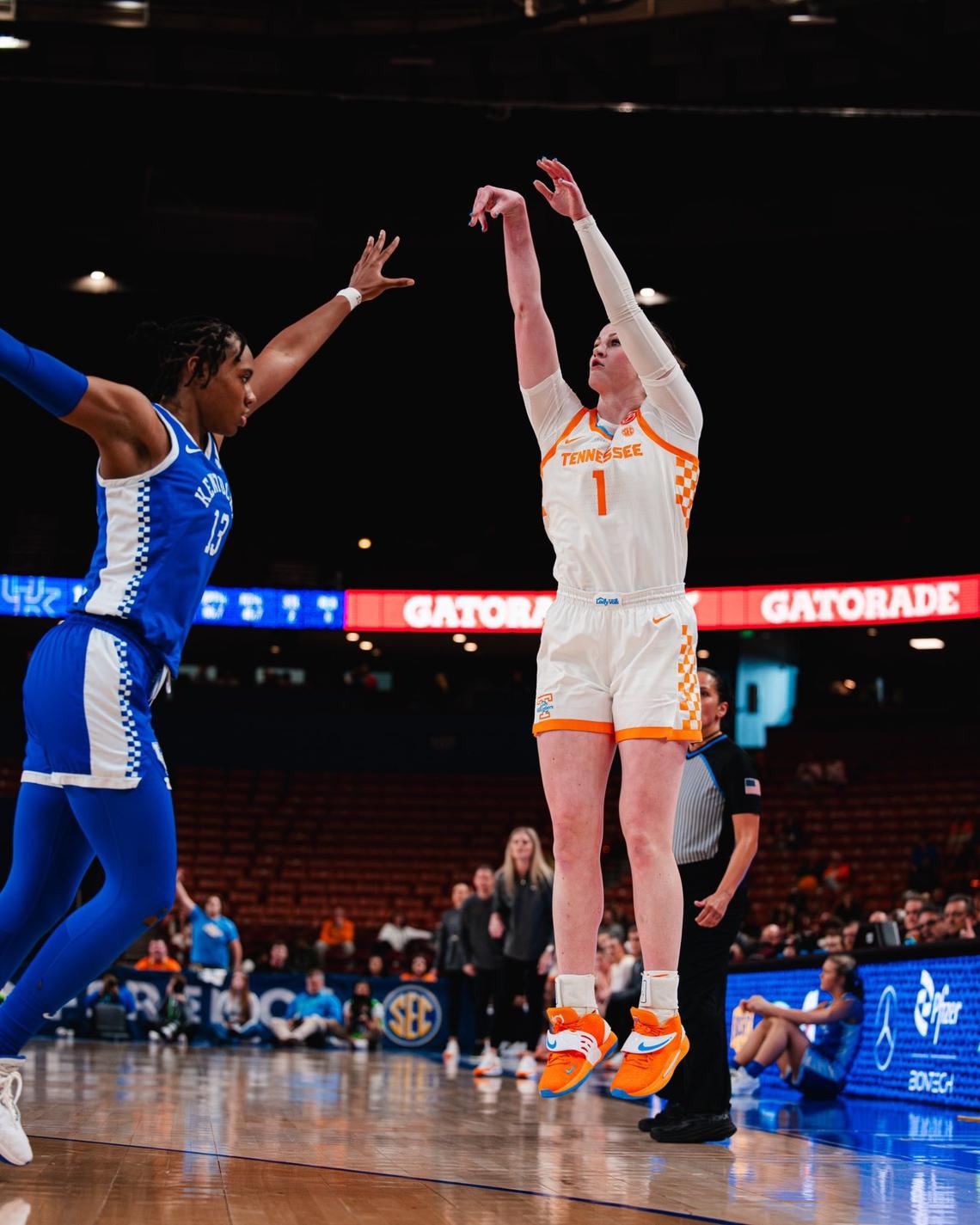 Tennessee’s Sara Puckett puts up a jumper over Kentucky’s Ajae Petty during Thursday’s game. Puckett, who averages 9.6 points per game, made four 3-pointers and scored 22 points to lead the Volunteers on Thursday.