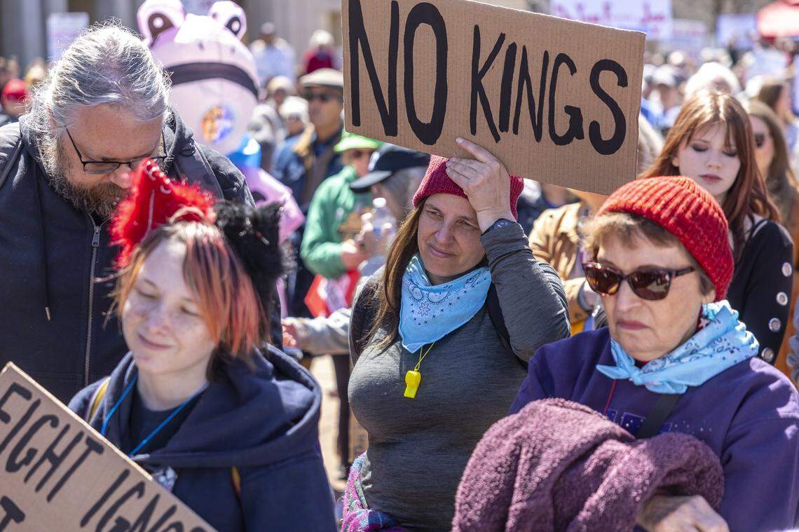 People attend a rally during a No Kings protest in downtown Lexington, Ky., on Saturday, March 28, 2026. 