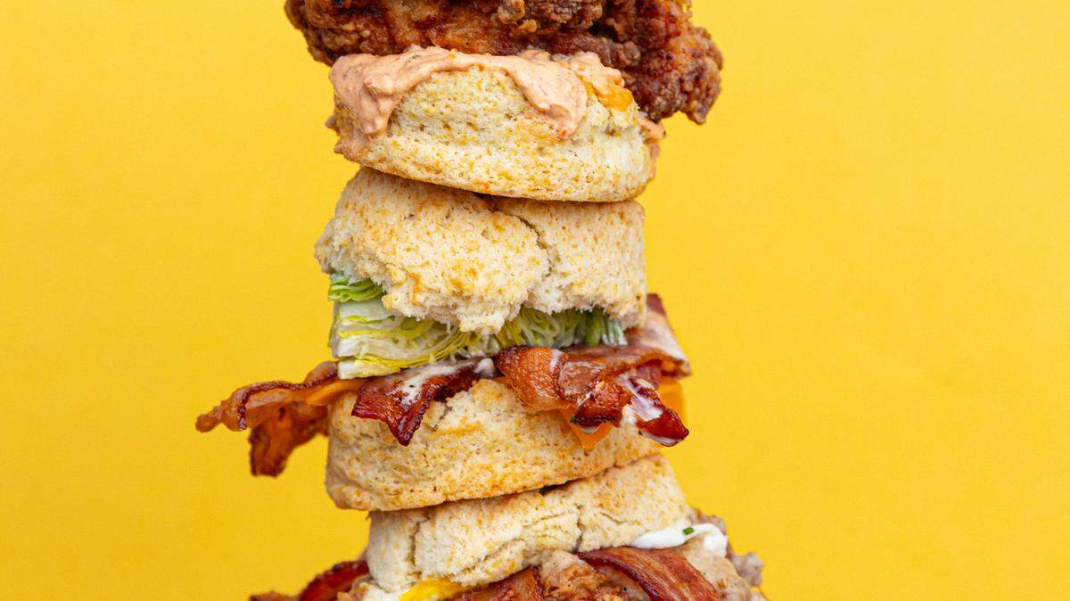 The Mama’s Boy, pictured at top from Biscuit Belly, features buttermilk fried chicken thigh, roasted jalapeno pimento cheese, pickles and a fried green tomato. In the middle is Towanda’s BLT and on the bottom is the Rockwell Supreme.