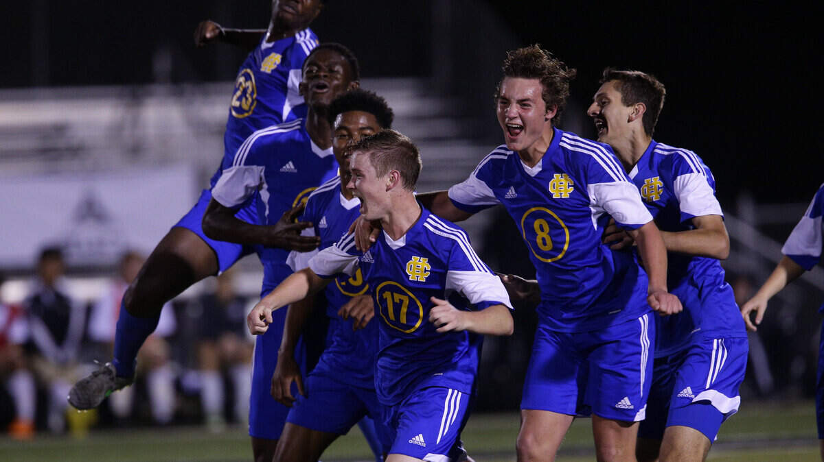 Henry Clay's Collin Rose (17) celebrated with his teammates after his first-half goal. His low liner deflected off a Bowling Green defender and gave the Blue Devils a 1-0 victory in the boys' state soccer semifinal at Paul Laurence Dunbar on Wednesday.    