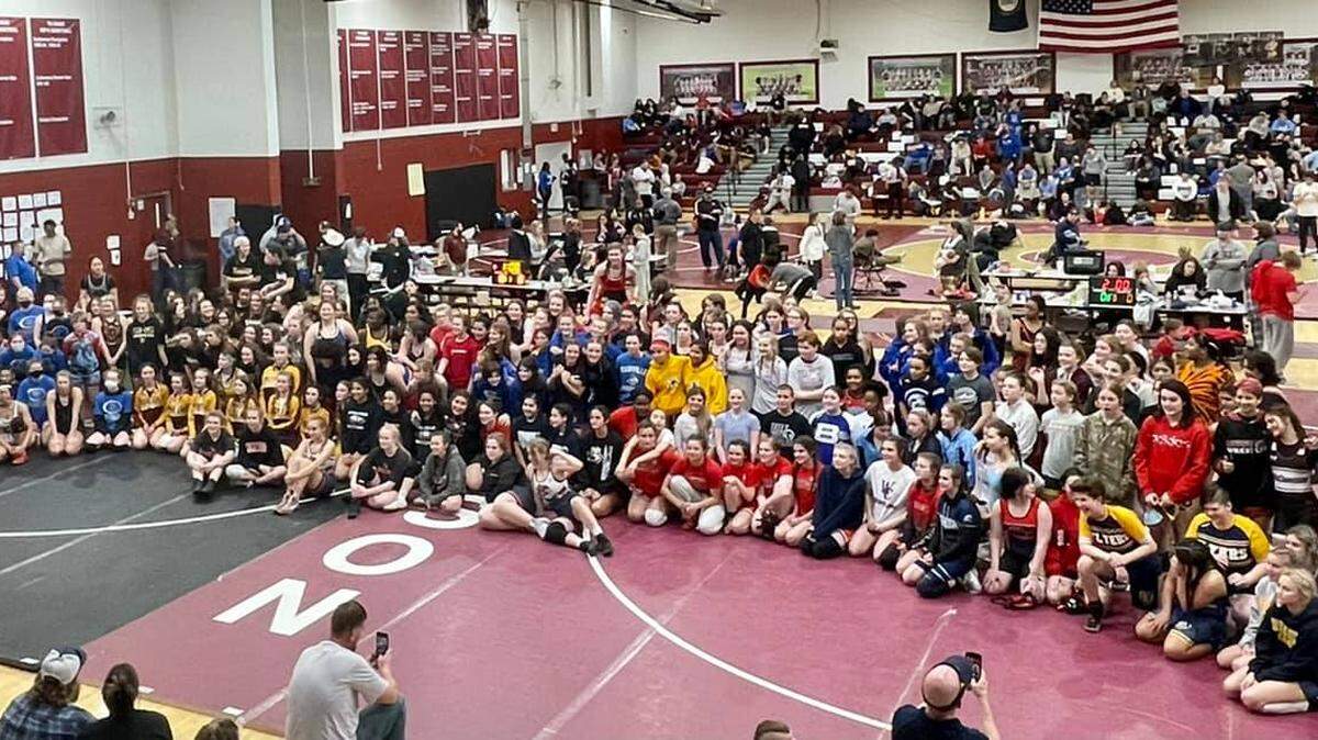 Wrestlers gathered on the mats for a group photo at the Kentucky Wrestling Coaches Association Girls’ State Championships at Harrison County Middle School in Cynthiana on Monday. The event included 210 competitors from 64 schools.