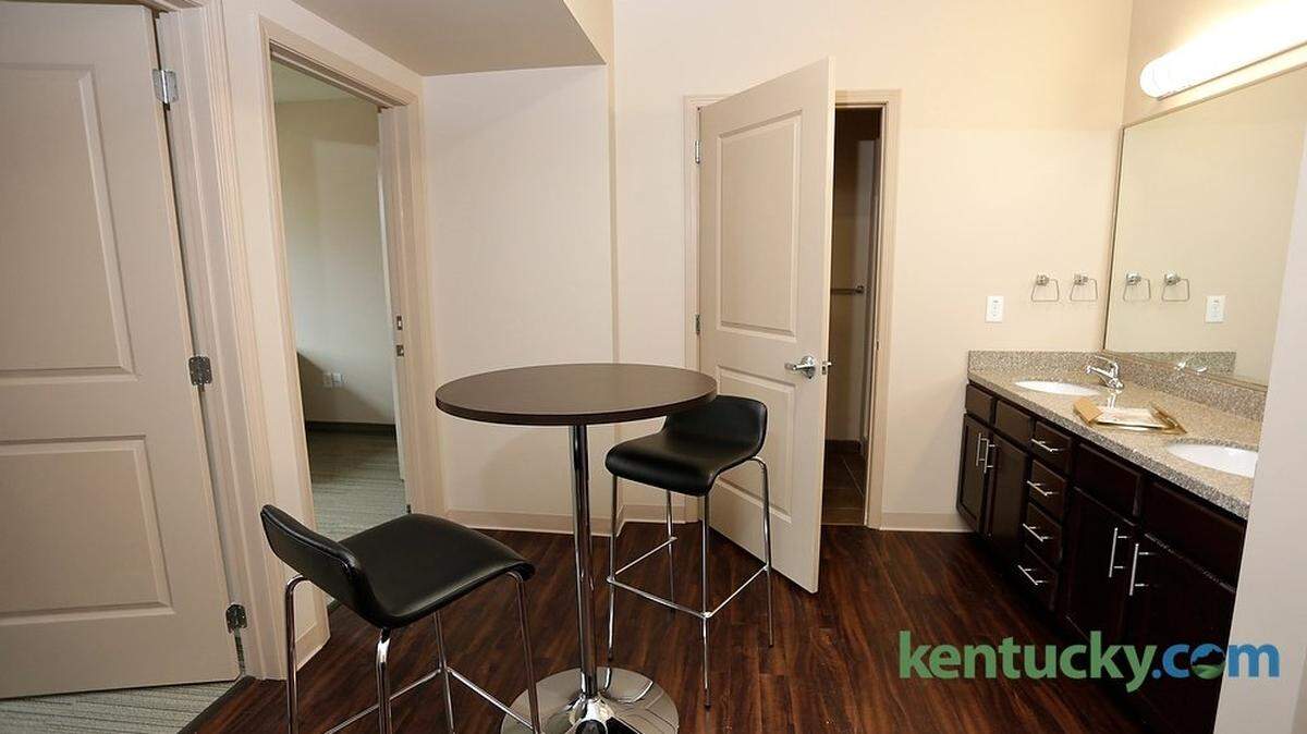A common area with sink, bathroom and kitchen area shared by two students with individual bedrooms at Woodland Glen I, a new dorm on the University of Kentucky campus across from the W.T.Young Library in Lexington, Ky., on Aug. 7, 2014.  Photo by Pablo Alcala | Staff