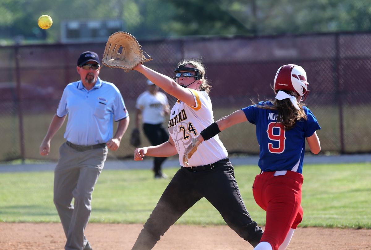 Woodford County’s Delaney Enlow stretched for the out Tuesday against Lafayette’s Anna Norby on Tuesday night.