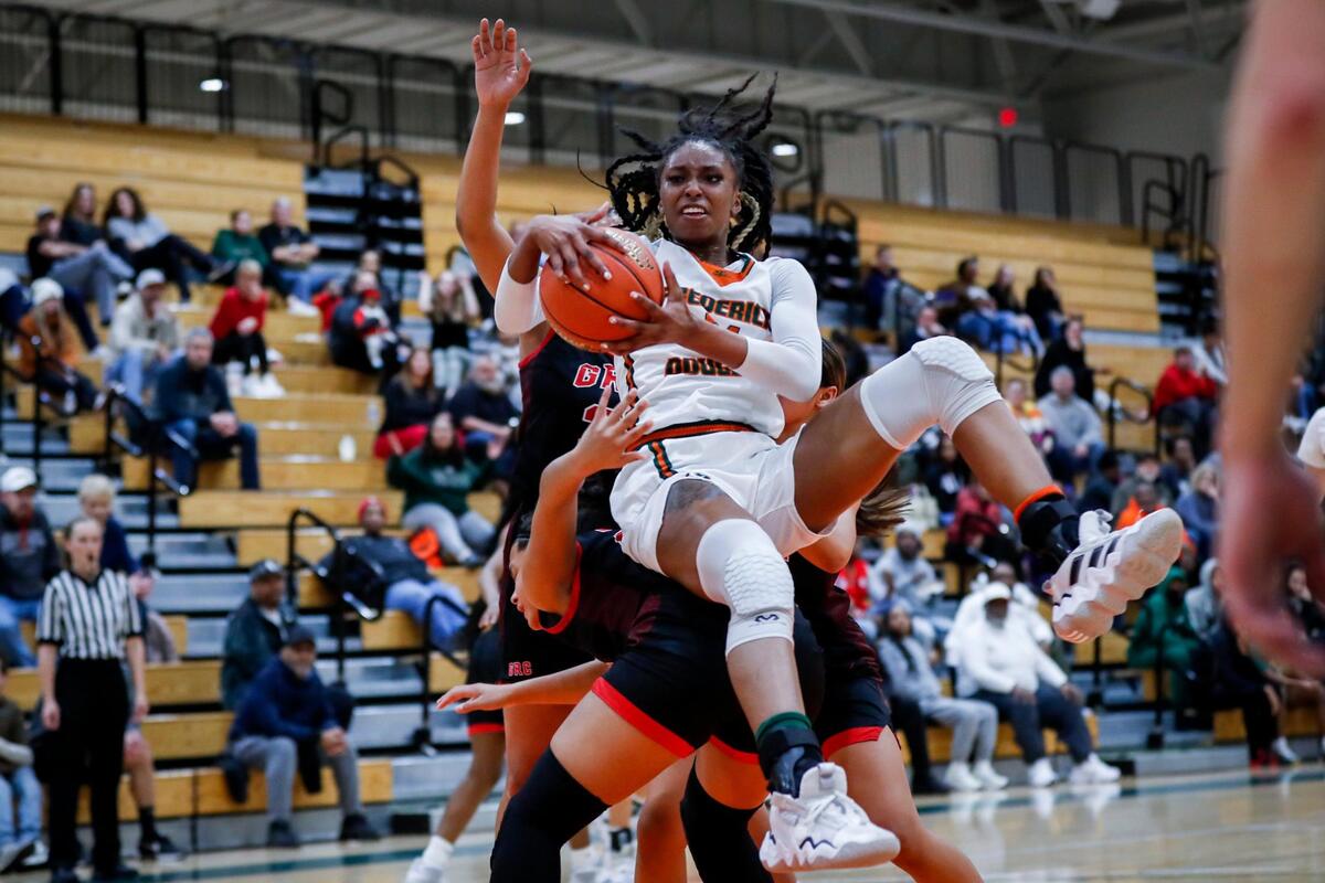 Ayanna Darrington (21) of Frederick Douglass wrestles for a rebound against George Rogers Clark on Wednesday night. Darrington finished with 12 points.