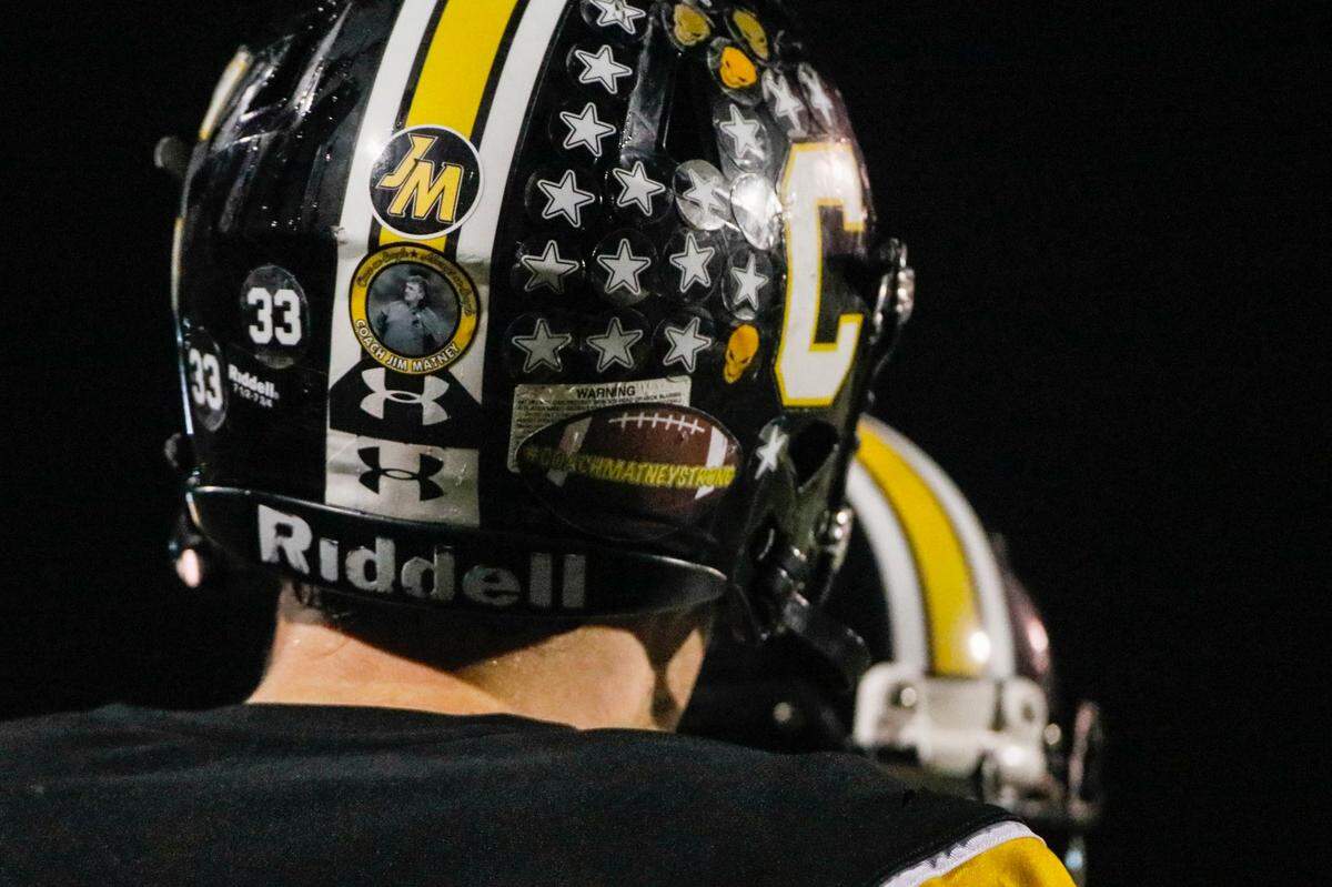 Johnson Central’s Keygan Pelfrey and his teammates wore stickers on their helmets to honor Jim Matney.