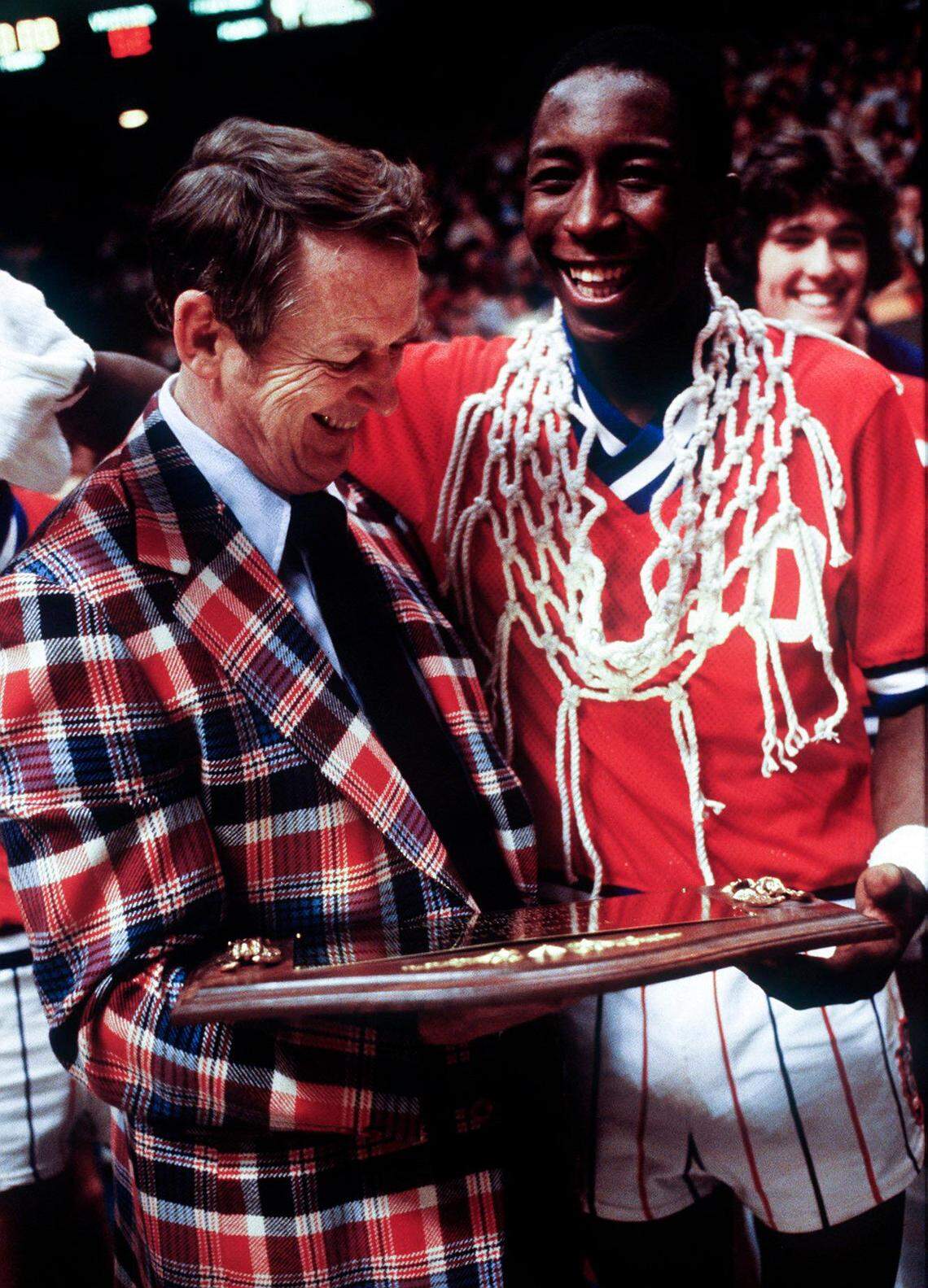 Lafayette basketball coach Jock Sutherland and Dirk Minniefield celebrate after their team won the Boys’ Sweet 16 on March 17, 1979, in Rupp Arena.