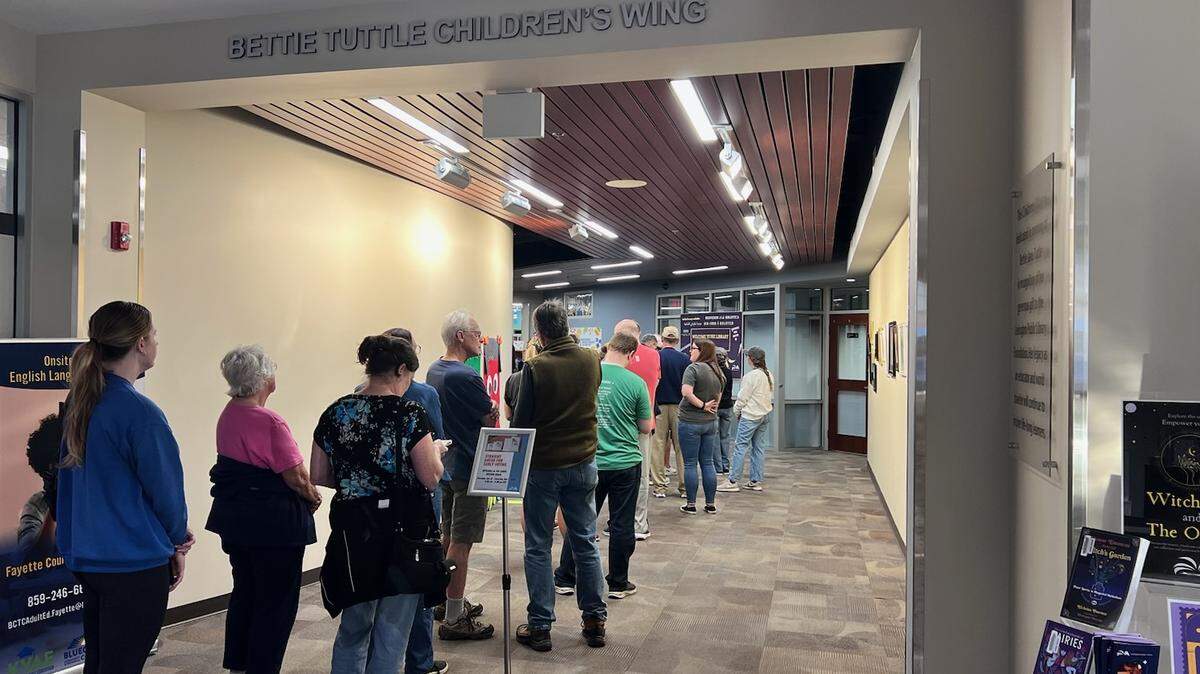 A line forms at the Lexington Public Library Eastside Branch on Thursday morning before the library opens. Thursday marked the first day of early voting in Kentucky, and lines were long across the six Lexington libraries that offered the service.