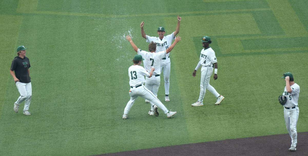 Trinity's Grayson Davis celebrates with teammates after the beat Boyd County in the KHSAA Boys Semi-Final Baseball Friday evening.June 13, 2025
