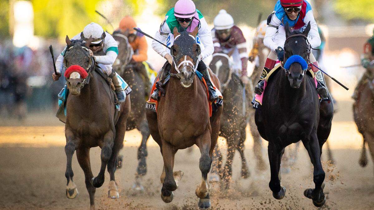 Hot Rod Charlie and Flavien Prat, left; Mandaloun with Florent Geroux, center; and Medina Spirit with John Velazquez raced during the 147th running of the Kentucky Derby at Churchill Downs on May 1.