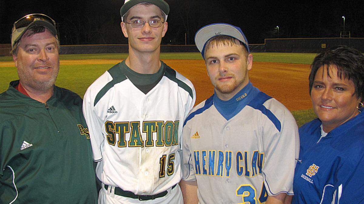 From left, Tim Curtsinger, Nathan Curtsinger, James Hendron and Tracy Curtsinger have learned to divide loyalties and cheer each other on, despite both boys playing for different schools.