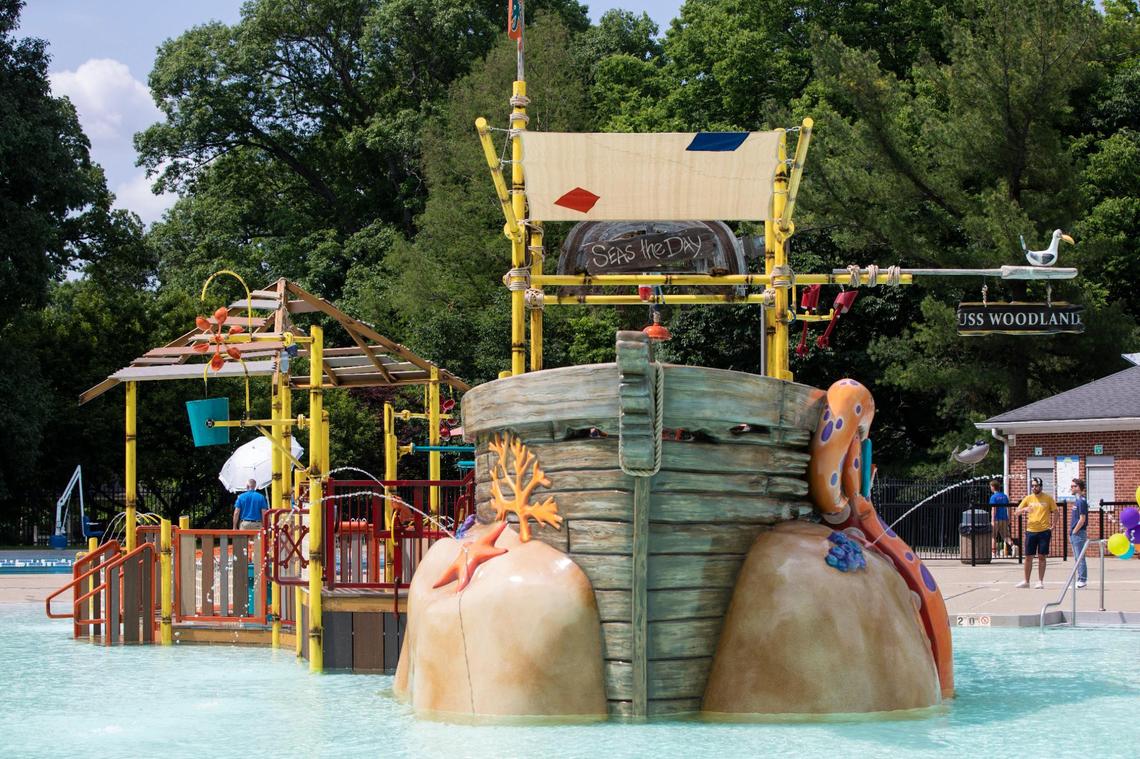 Children play on and near the newest pool feature at the Woodland Aquatic Center: Paradise Lagoon, a shipwreck-themed feature at Woodland Aquatic Center at Woodland Park in Lexington, Ky., Friday, May 26, 2023.