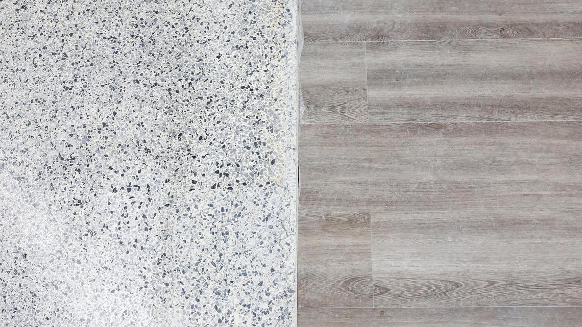 Old floor, shown at left, meets new floor inside Eastern Kentucky University’s renovated Baptist Health Arena at Alumni Coliseum. The arena was built in 1963 and is undergoing a three-phase renovation that will be fully done in the summer.