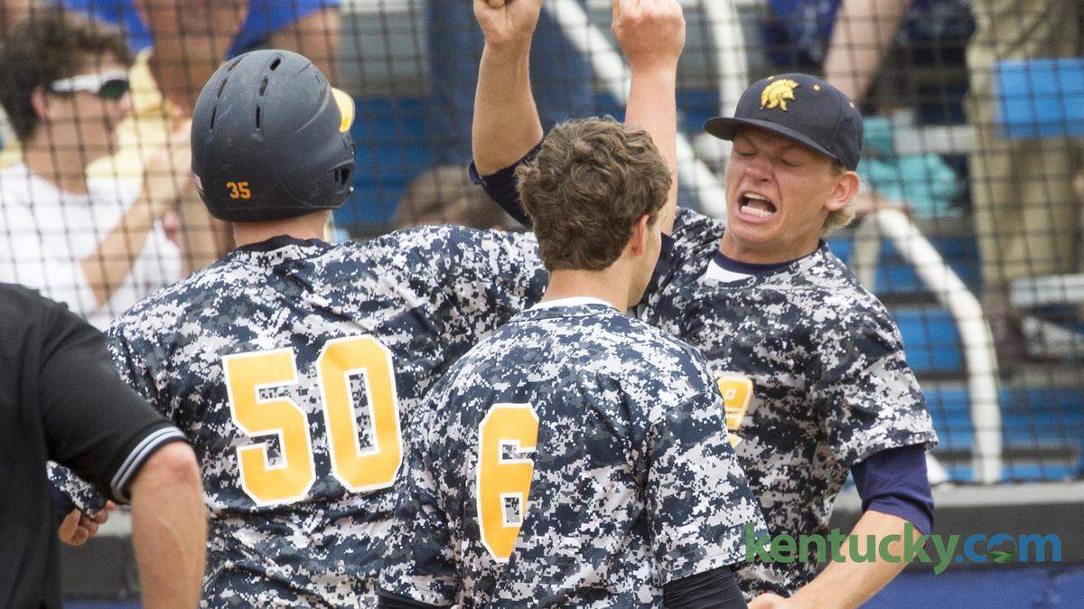 Sayre's Sam Van Balen (50) was greeted by Aidan Elias (2) after he and Mason Jasko (6) scored in the 7th inning as Sayre defeated Lafayette 6-2 in the 11th Region baseball tournament opener played at Henry Clay, Lexington, Ky. on May 25, 2015.  Photo by Mark Mahan