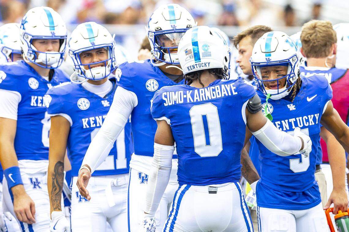 Kentucky running back Demie Sumo-Karngbaye (0) is cheered by his teammates after scoring a touchdown against Ohio on Saturday at Kroger Field.