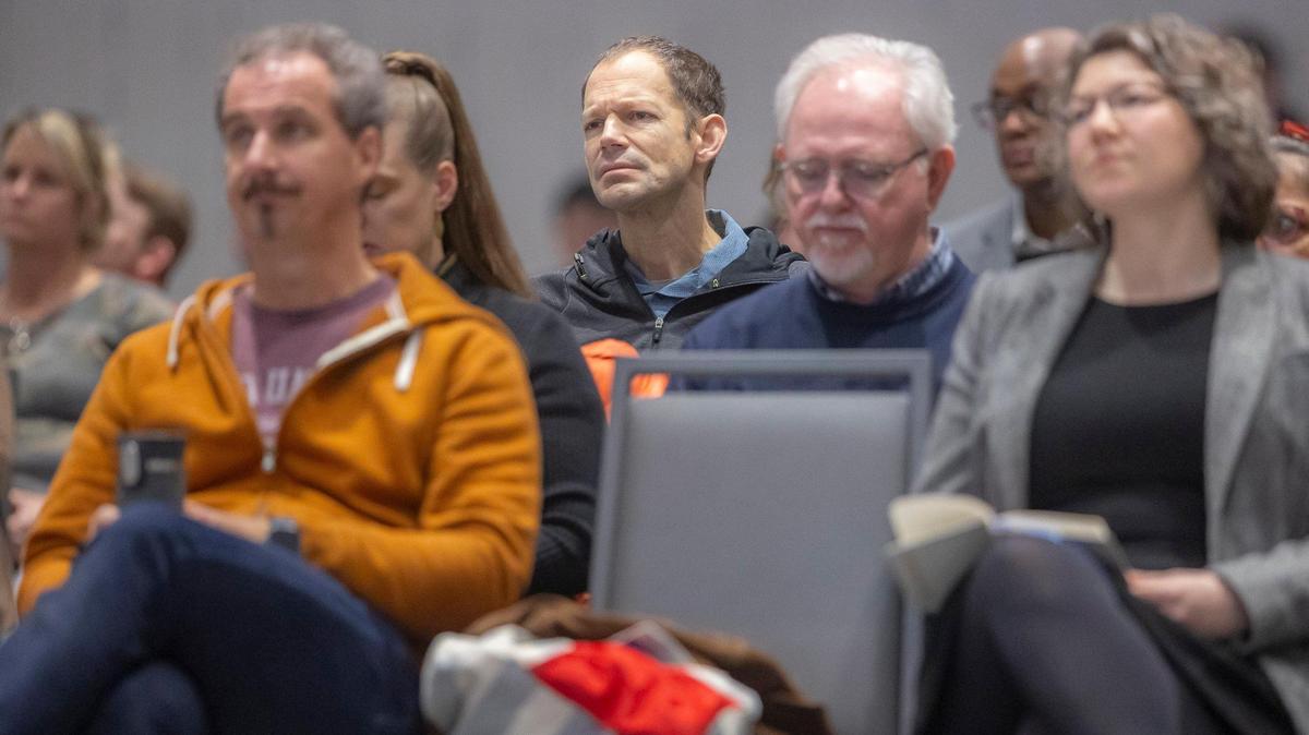 Attendees listen to a presentation during a University of Kentucky Board of Trustees meeting at the Gatton Student Center on the UK campus in Lexington, Ky., on Friday, Feb. 23, 2024.