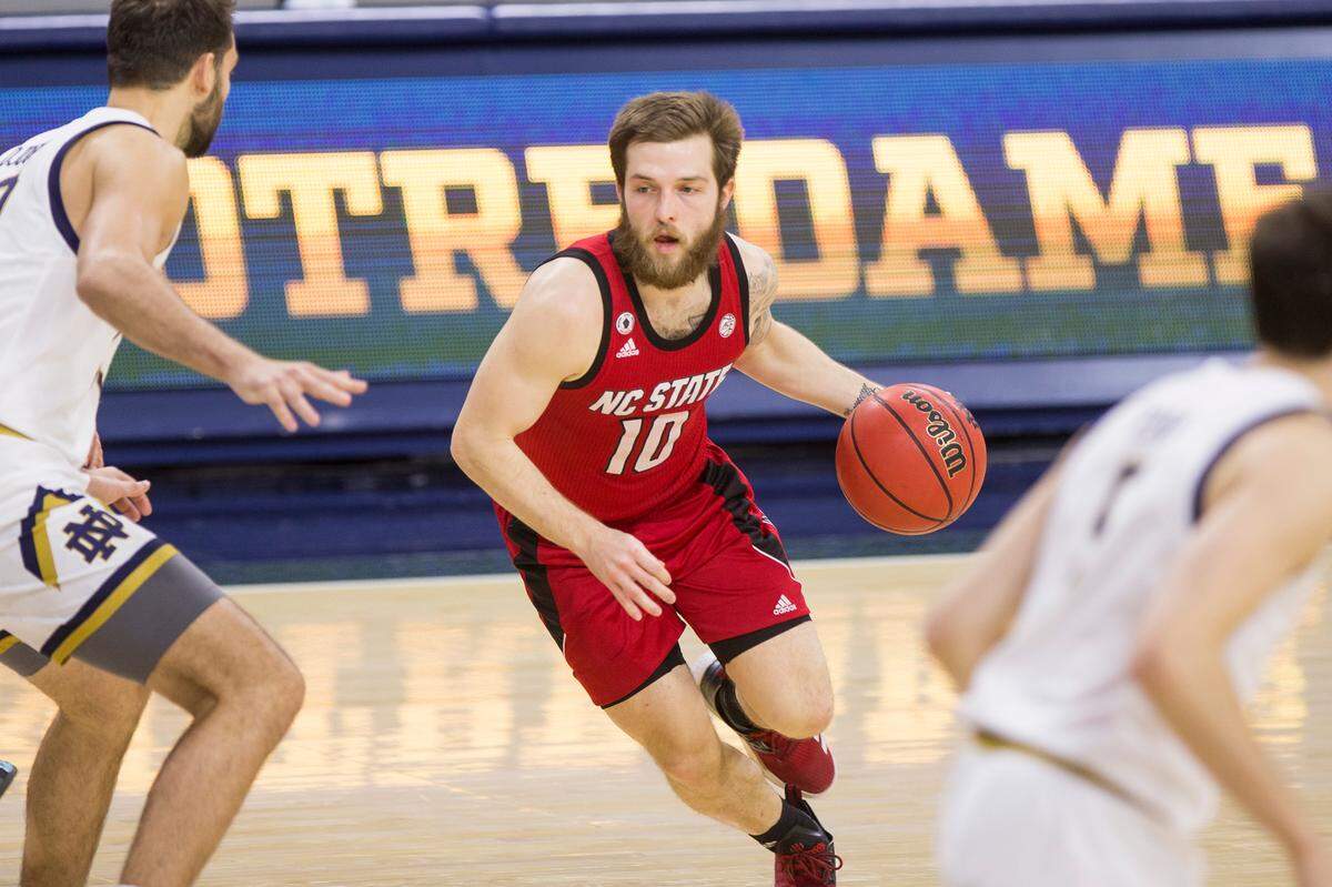 New Eastern Kentucky Colonels point guard Braxton Beverly (with ball), a former star at Perry County Central High School, played in 121 games, starting 88, in his four-year career at North Carolina State.