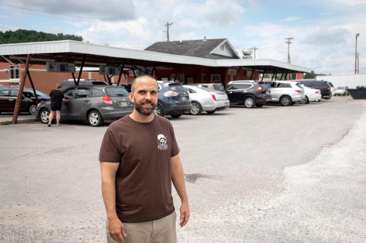 Robert Champlin, the manager and son of the owner Willie Champlin stands in front of the Crabtree Restaurant Inc., better known as the Root Beer Stand, operates in Corbin.