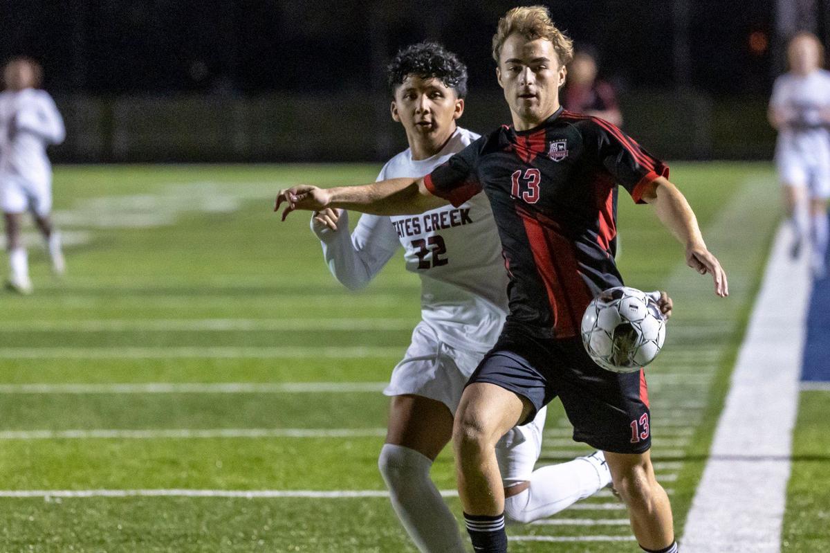 Paul Laurence Dunbar’s Chaz Rich and Tates Creek’s Edwin Luna battled for control of the ball during the 43rd District championship at Lafayette High School on Thursday.