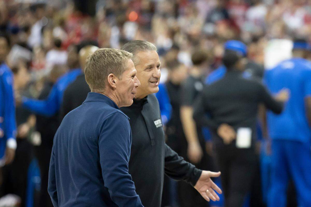 Gonzaga Bulldogs head coach Mark Few and Kentucky Wildcats head coach John Calipari speak before a game at Spokane Arena in Spokane, Wash., on Sunday, Nov. 20, 2022.