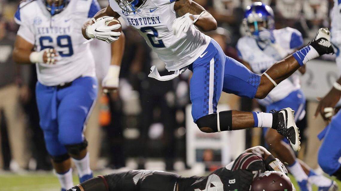 Kentucky Wildcats wide receiver Dorian Baker (2) leap over Mississippi State linebacker Beniquez Brown (42) in the first quarter of the Kentucky at Mississippi State football game at Davis Wade Stadium in Starkville, Miss., on Oct. 24, 2015. Photo by Pablo Alcala | Staff