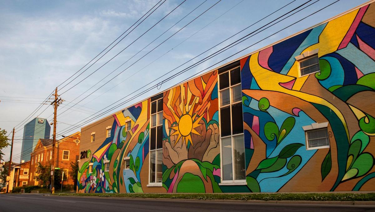 The mural, “A New Day Dawning,” created by Kentucky artist Casey McKinney was painted on New Vista’s 201 Mechanic Street location in downtown Lexington.