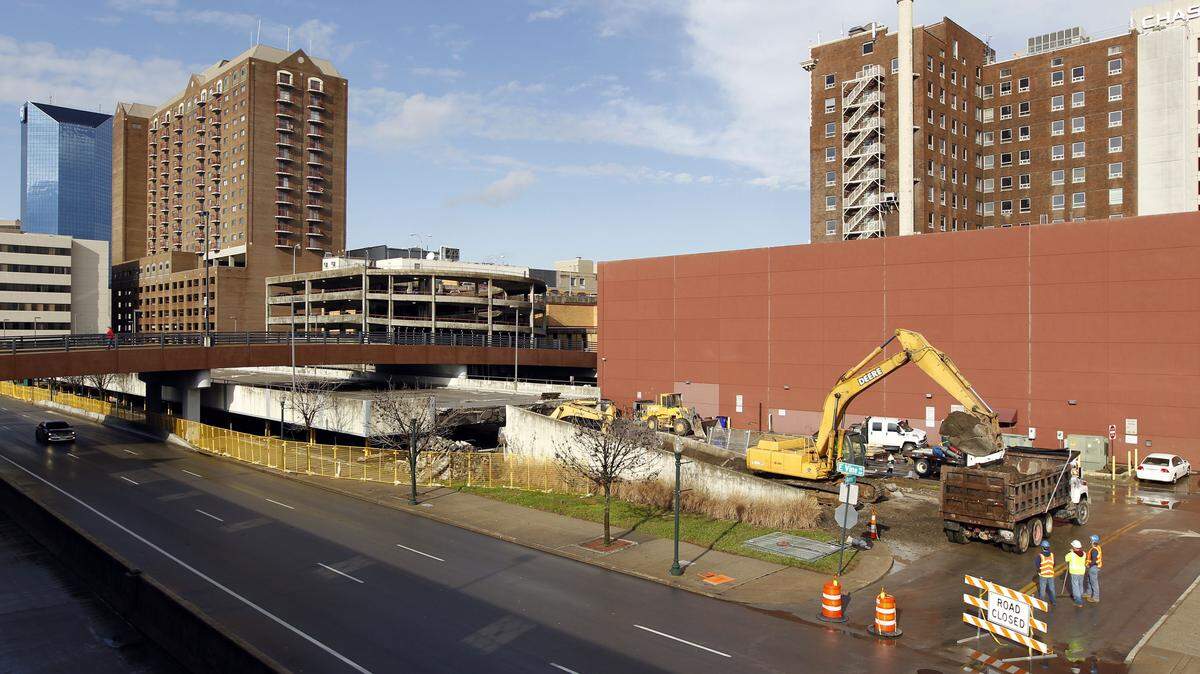 Superior Demolition began taking down the structure's upper deck Tuesday  morning. The work will affect traffic patterns at the library parking garage and nearby streets.   