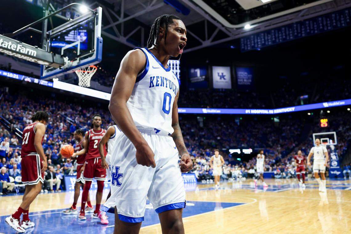 Kentucky guard Rob Dillingham celebrates scoring and drawing a foul against New Mexico State.