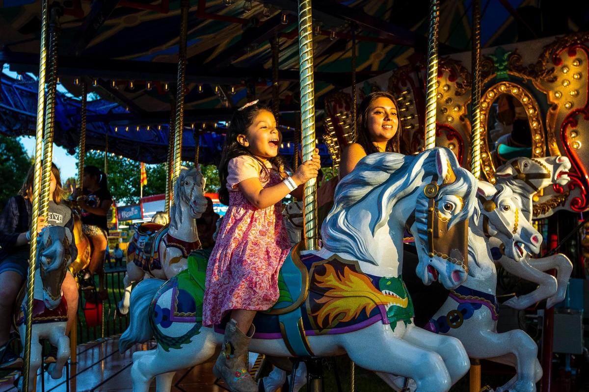 Patrons enjoy the Lexington Lions’ Club Bluegrass Fair at Masterson Station Park in Lexington, Ky., Thursday, June 9, 2022.