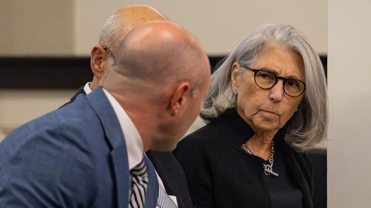 Fayette Circuit Judge Julie Goodman and her attorneys Mitchel Denham and Robert McBride consult with one another prior to her impeachment hearing held in room 131 at the Capitol Annex Building in Frankfort, Ky, on March 16, 2026.