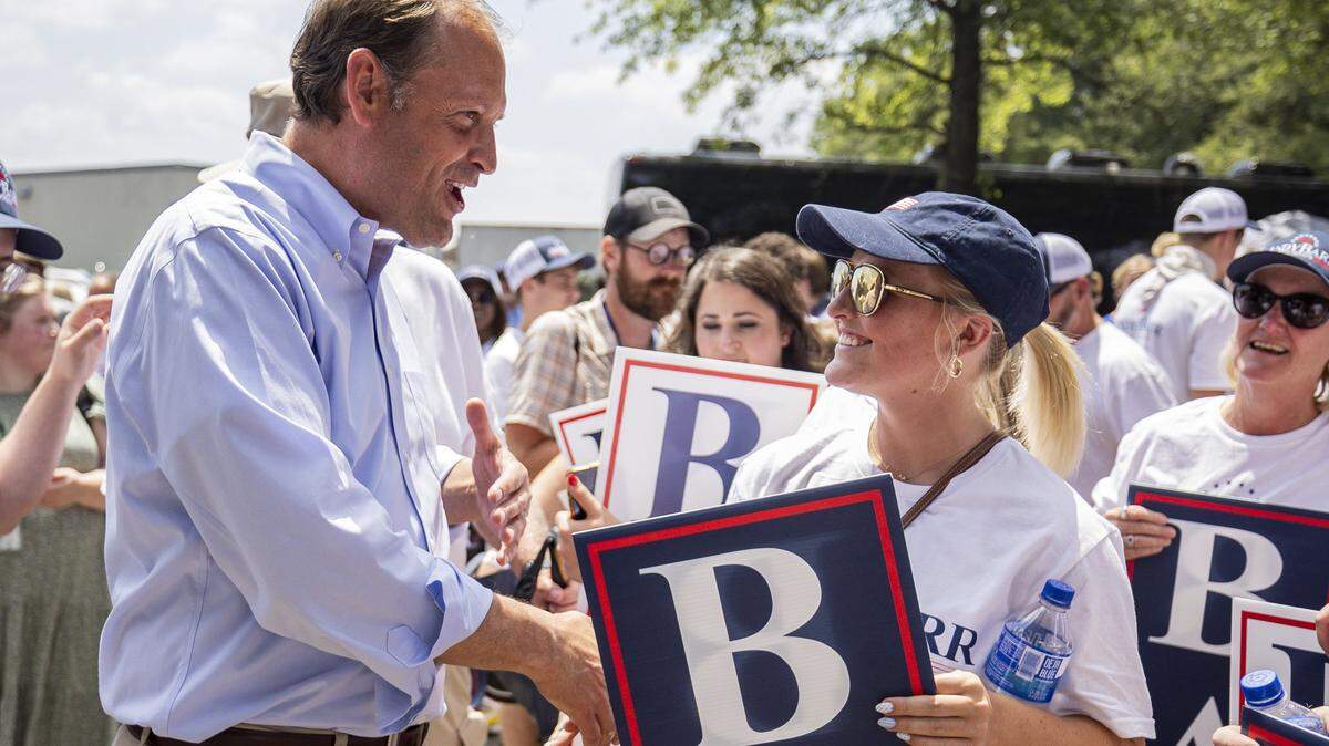 Andy Barr, left, shakes hands with one of his supporters during Fancy Farm Picnic on Saturday, Aug. 2, 2025, at St. Jerome Church in Fancy Farm, Ky.
