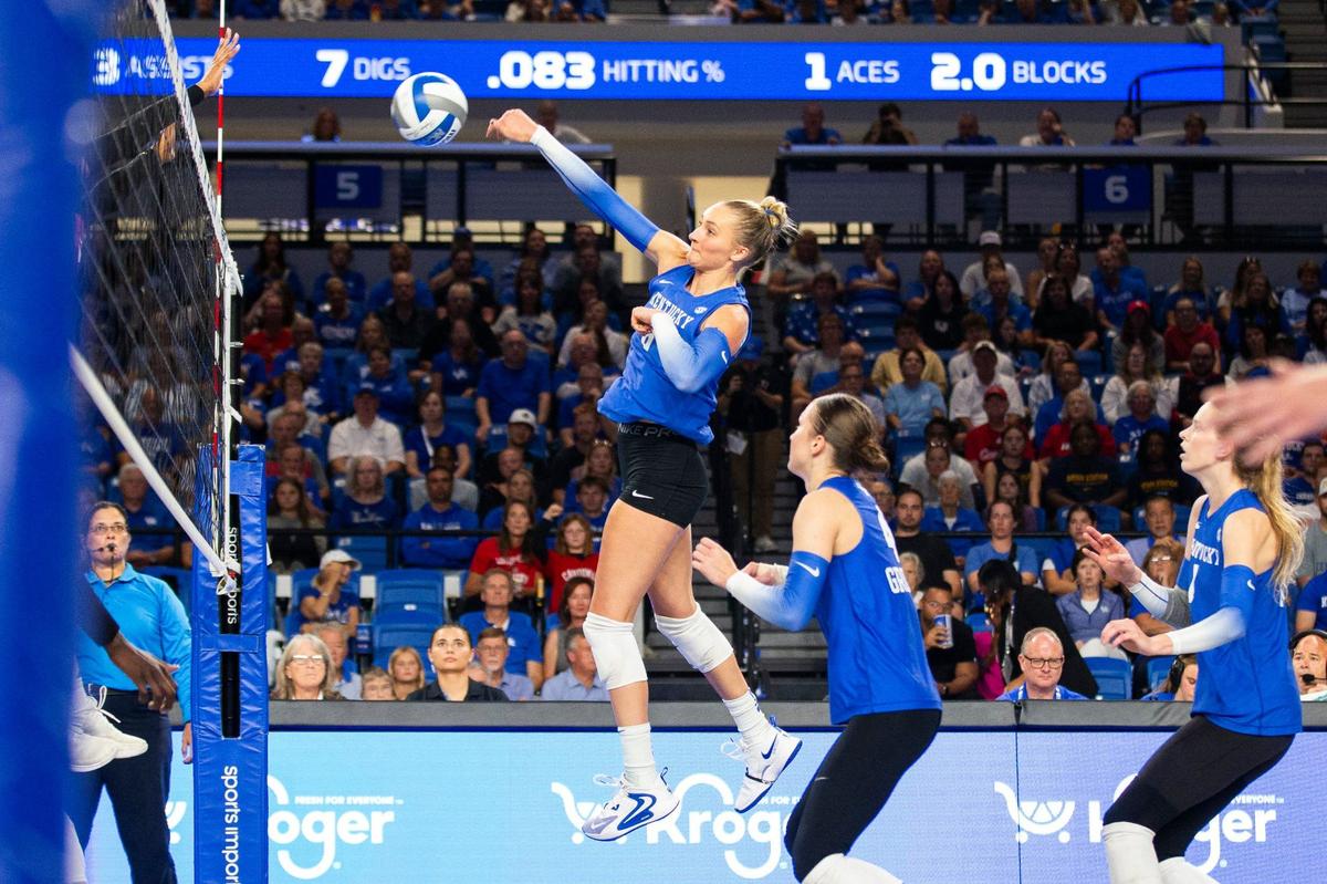 Kentucky’s Brooke Bultema (8) hits the ball during Wednesday’s loss to Louisville. The Wildcats fell to 0-4 against ranked opponents this season.