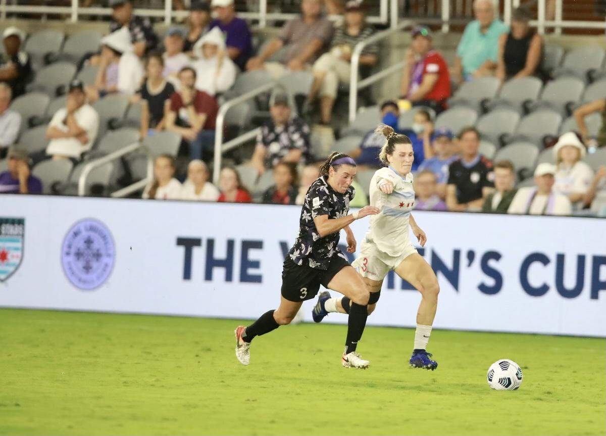 Arin Wright of the Chicago Red Stars, right, battled Racing Louisville’s Erin Simon during Wednesday night’s match in Louisville. Wright, who starred for the University of Kentucky from 2011-14 as Arin Gilliland, was playing professionally in our state for the first time.