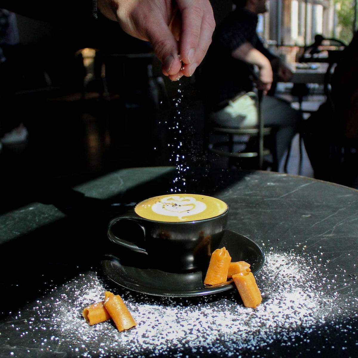 For Lexington Coffee Week, The Dark Horse from Manchester Coffee Co. includes miso-caramel, charge espresso, steamed oat milk and a gomashio furikake garnish in a Cappuccino format.