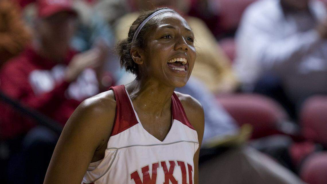 Crystal Kelly cheers on her teammates from the sideline during Western Kentucky’s game against Morehead State in Bowling Green in 2007. Kelly left WKU as the 12th-leading scorer in NCAA Division I history.