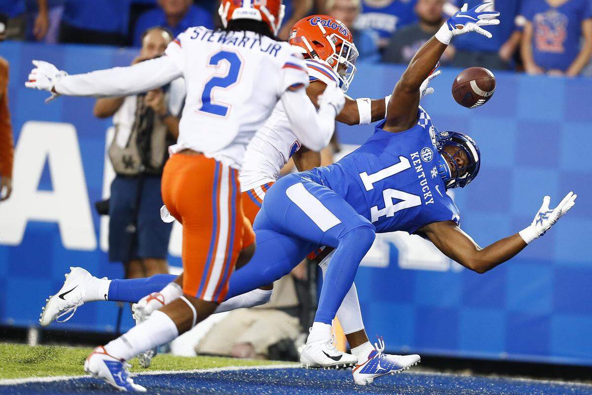 Kentucky wide receiver Ahmad Wagner (14) made a circus catch in the end zone for a touchdown in UK’s 29-21 loss to Florida. It was the second straight game with a TD catch for Wagner, the former Iowa basketball player.