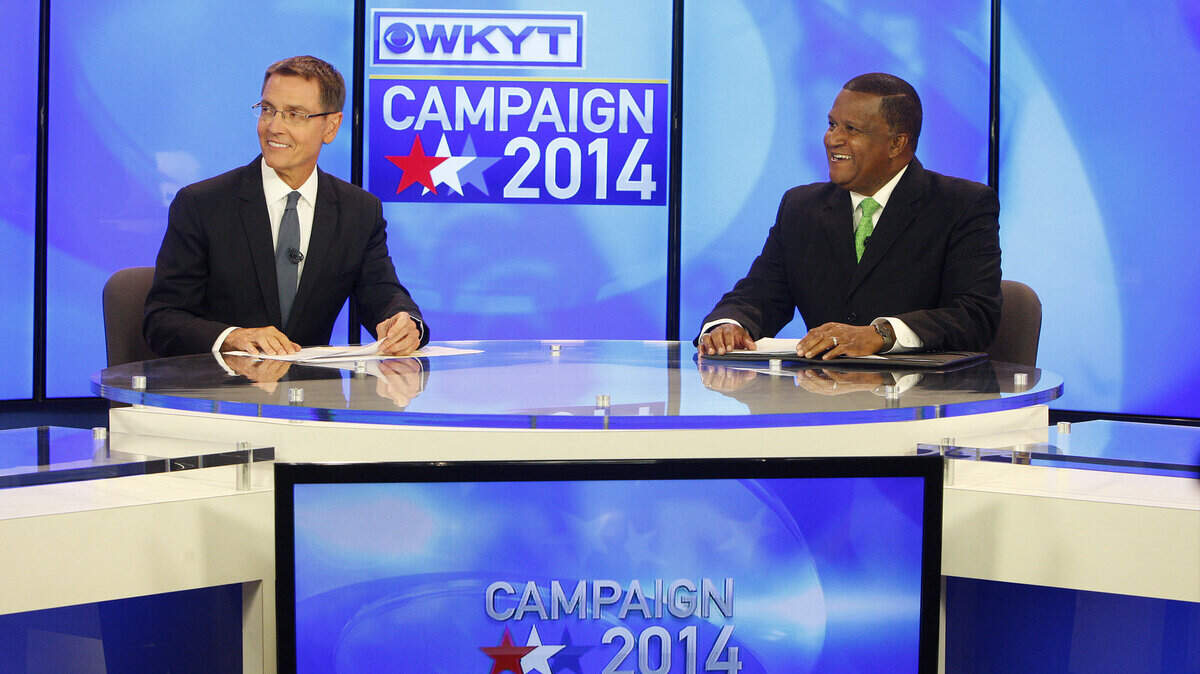 Jim Gray, left, and Anthany Beatty chatted with moderator Bill Bryant before Sunday's forum for mayoral candidates.  