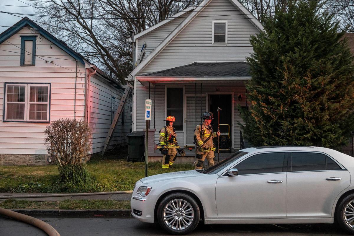 Members of the Lexington Fire Department respond to a structure fire on Ohio Street in Lexington, Ky., on Monday, Dec. 27, 2021.