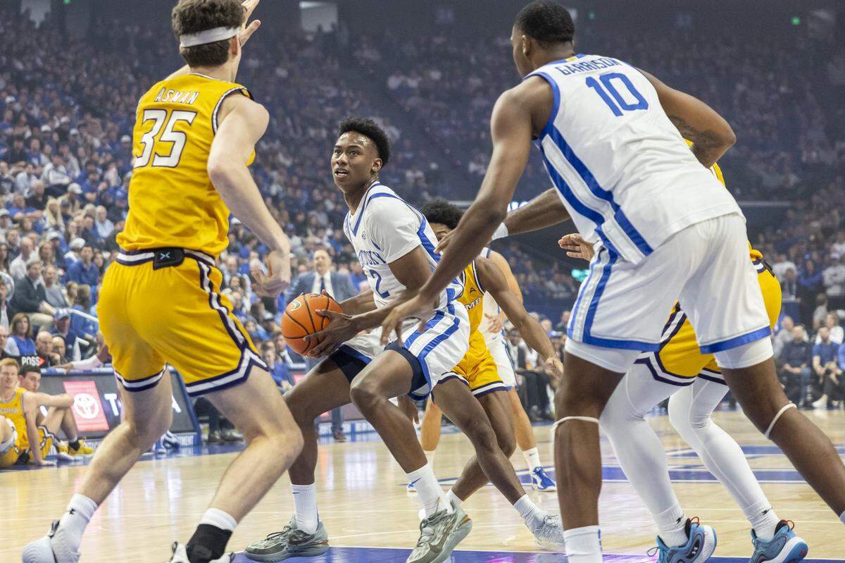 Kentucky guard Jaxson Robinson (2) drives the ball as Lipscomb center Grant Asman (35) defends during Tuesday’s game at Rupp Arena.