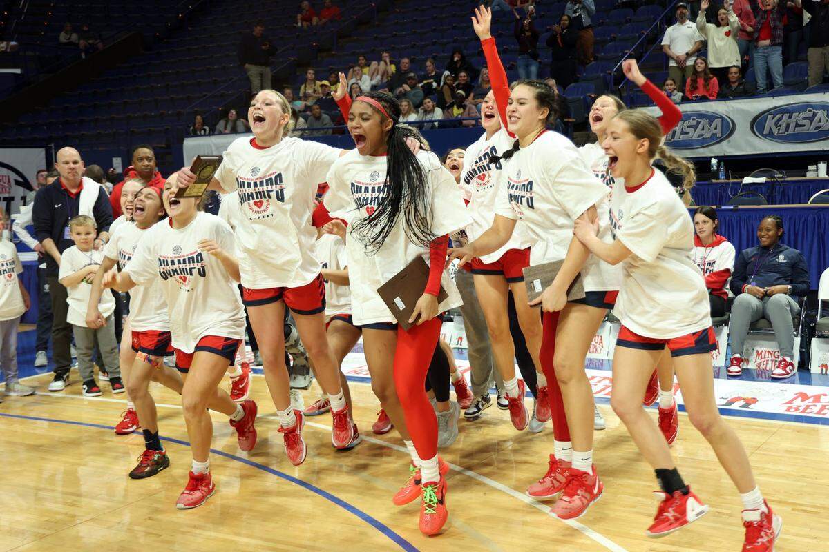 Sacred Heart players celebrated after winning the Girls’ Sweet 16 state basketball tournament championship in Rupp Arena last March. The private school in Louisville is seeking its record fifth consecutive state championship in 2024-25.