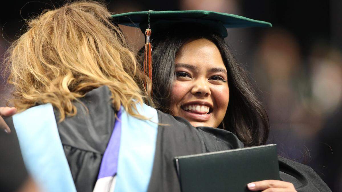 Graduates of Frederick Douglass High School receive their diplomas during the Fayatte Co. HS graduation ceremony at Rupp Arena on May 31, 2024, in Lexington, Ky