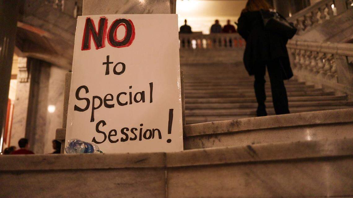A sign is placed at the bottom of the steps inside Kentucky Capitol near the House of Representatives, where a crowd gathered to protest governor Matt Bevin’s surprise legislative session Monday evening.