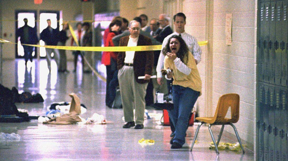 A Heath High School student screams at seeing the scene of a shooting at the school, Monday, Dec. 1, 1997, which left three students dead and five others wounded. Michael Carneal, the shooter, is seeking parole after 25 years in prison.