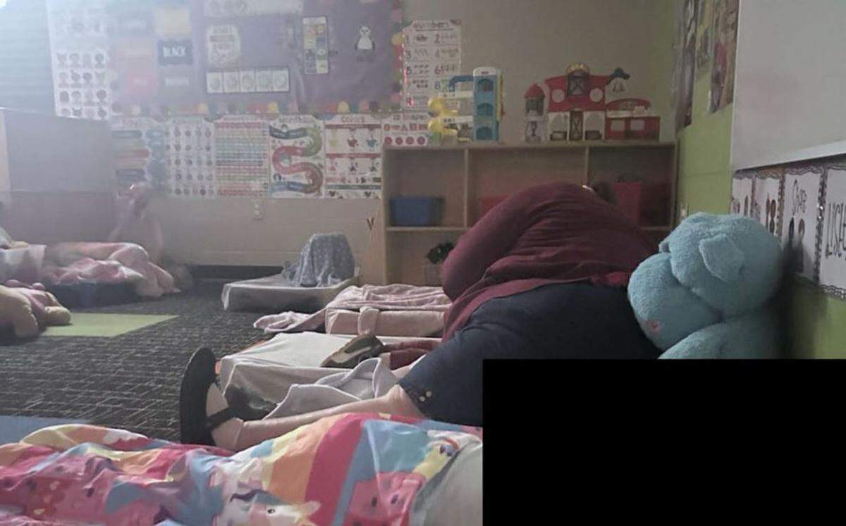 A teacher at St. Cecilia Early Childhood Learning Center in Independence was photographed while lying down on a boy during nap-time in April 2024. The incident became the subject of a complaint to state officials.