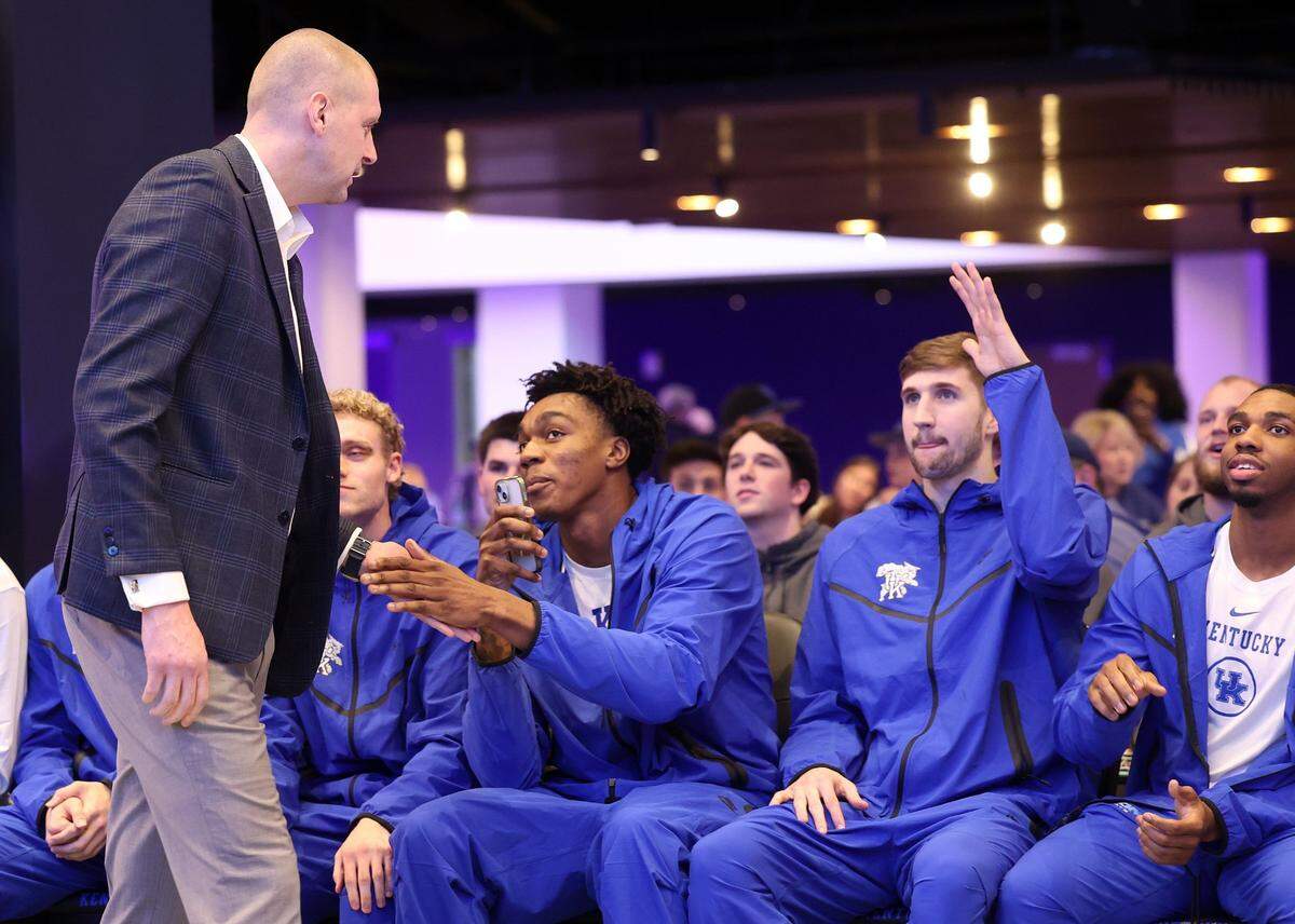 Kentucky head coach Mark Pope interacts with his players after the Wildcats’ seeding was announced during the NCAA Selection Show on Sunday.