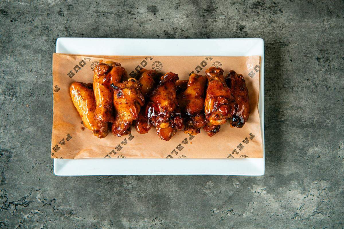 PARLOUR serves pizza, grinders and smoked chicken wings.