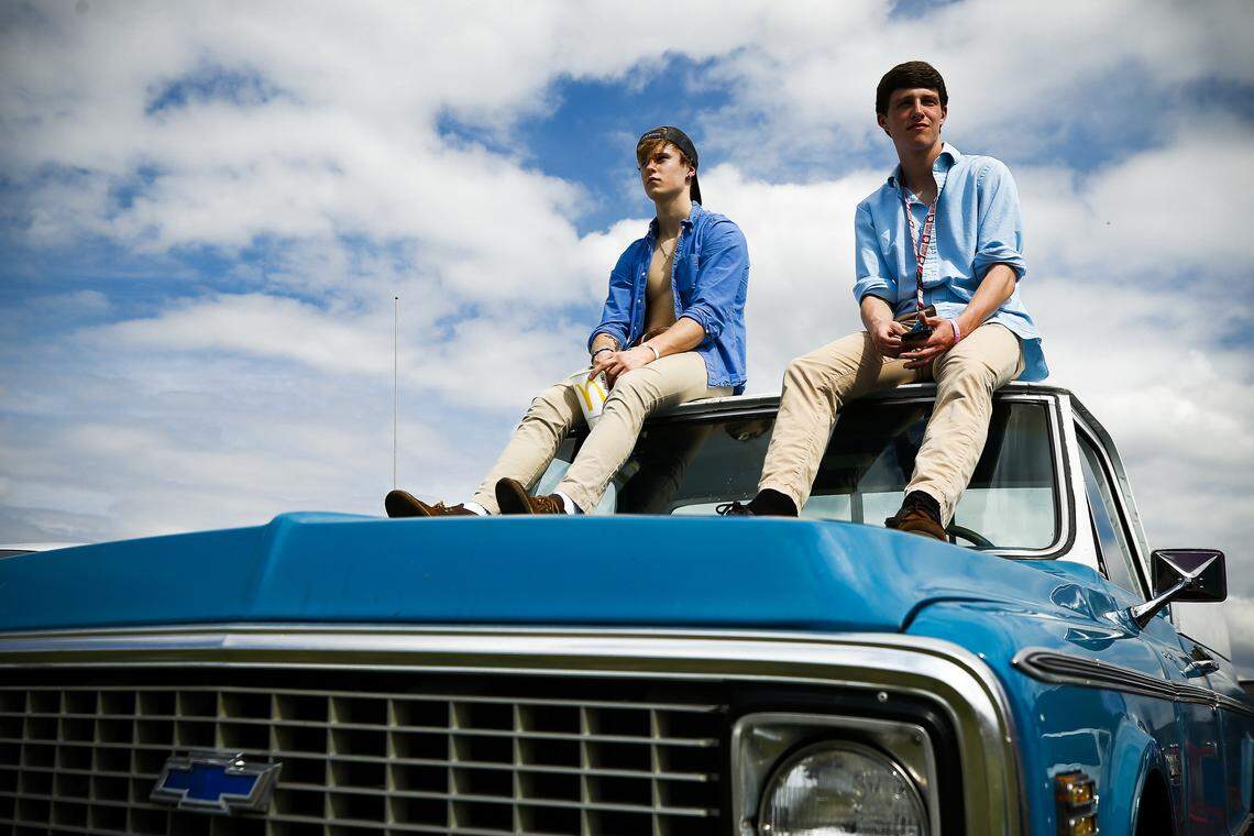 Harrison Rogers, left, and Jed French, 17, both of Lexington, sat atop a 1972 Chevrolet truck while tailgating on the hill at Keeneland in Lexington, Ky., Saturday, April 6, 2019.