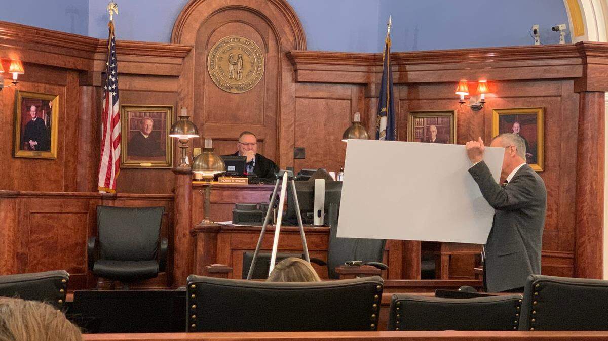 Associate Attorney General shows Franklin Circuit Judge Thomas Wingate a map from a previous case, which he argued is relevant to the Kentucky Democratic Party’s suit against new redistricting maps.